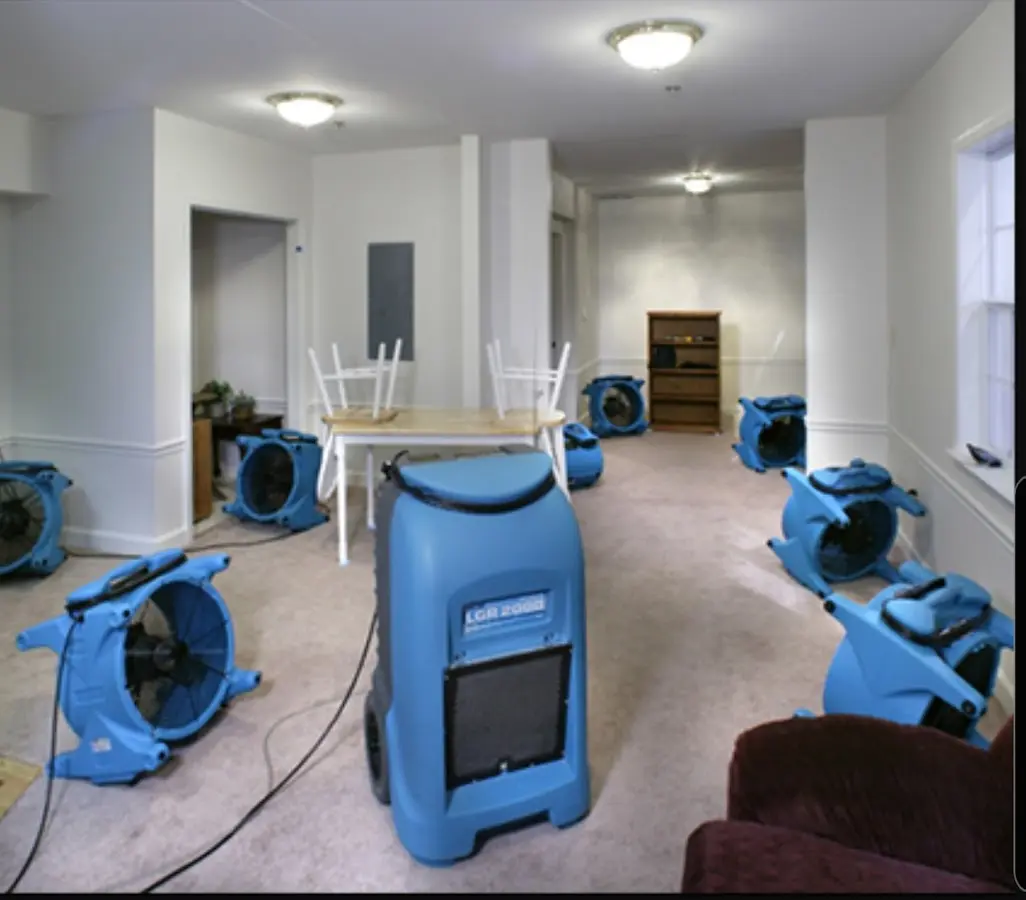 Air movers and dehumidifier setup for Water Damage Restoration in Mustang